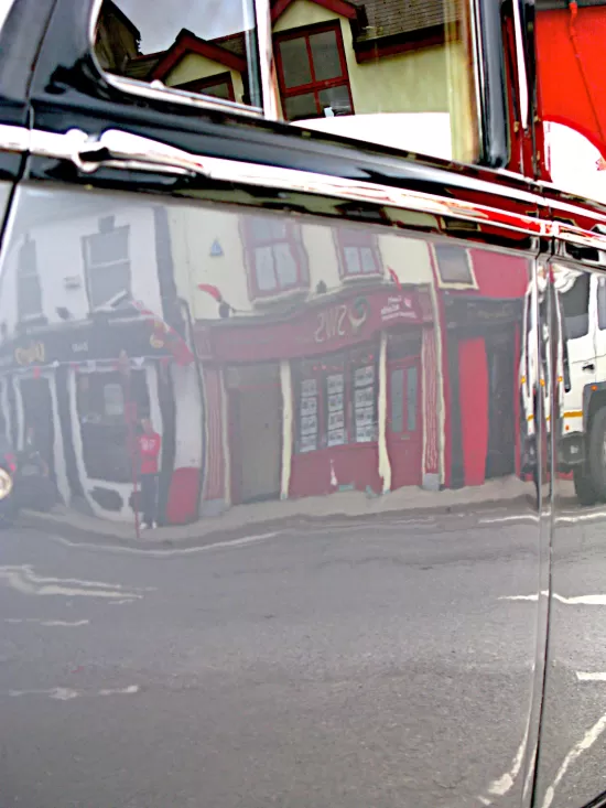 Reflections in silver car