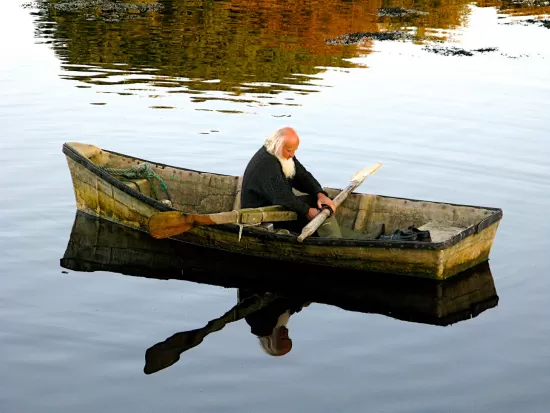 Old man in rowboat
