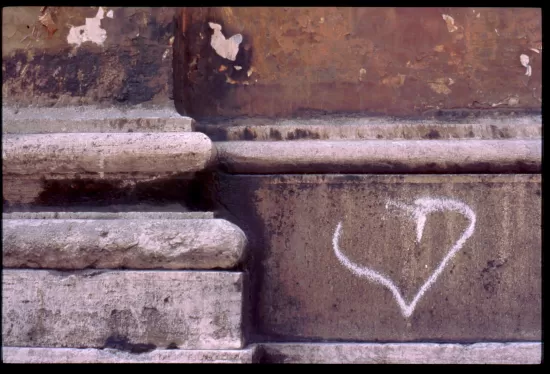 Heart graffiti on an acient stucco wall