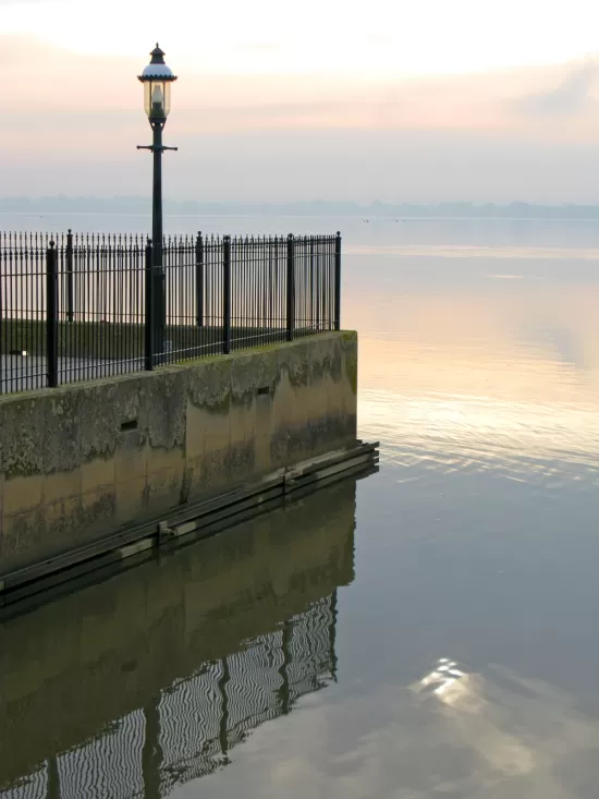 Edge of river wharf on calm day